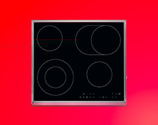 Een kookplaat op een rode achtergrond