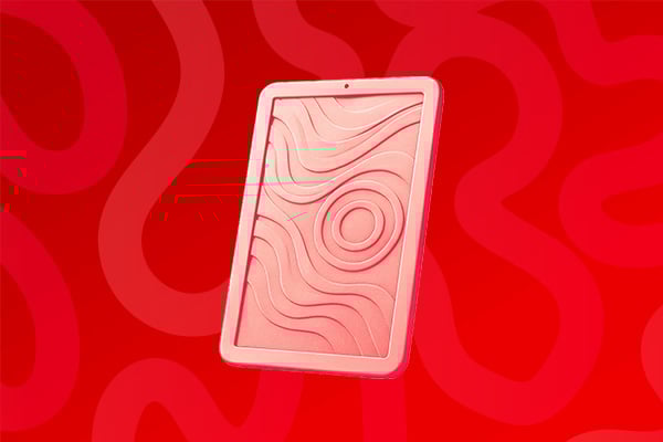 Une tablette sur un fond rouge
