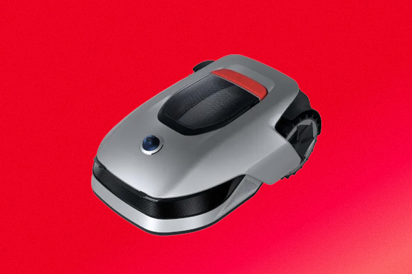 Tondeuse robot grise sur fond rouge.